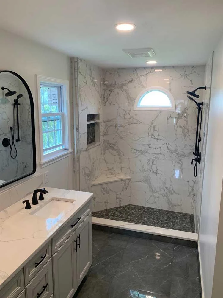 Bathroom example with vanity and walk-in shower.