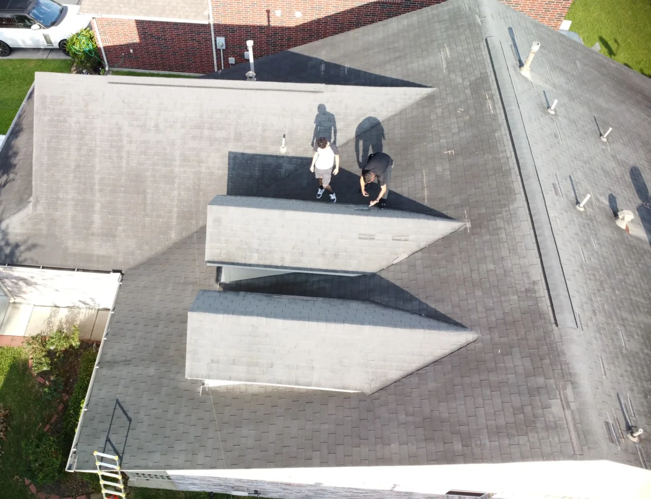 E Torres Solutions documenting roof conditions during inspection