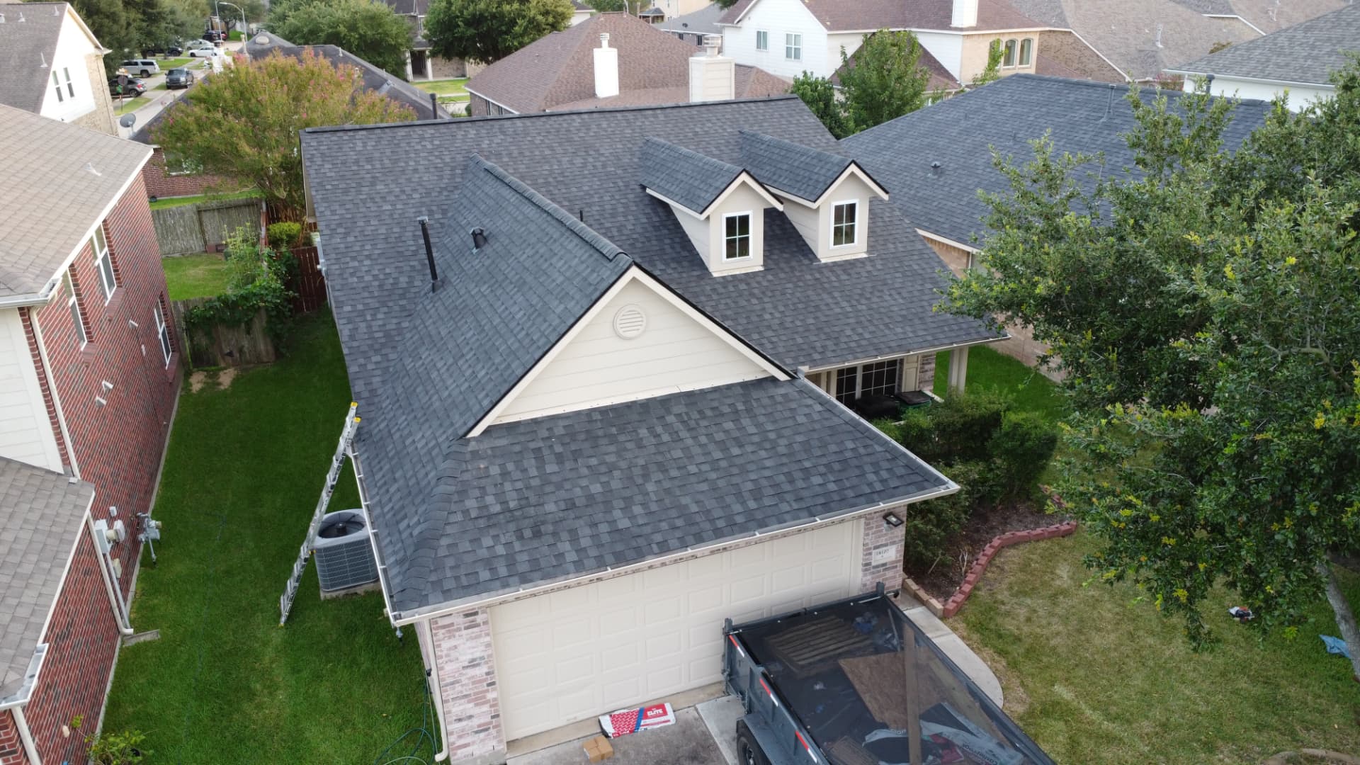 Completed residential roofing project photographed from above by E Torres Solutions