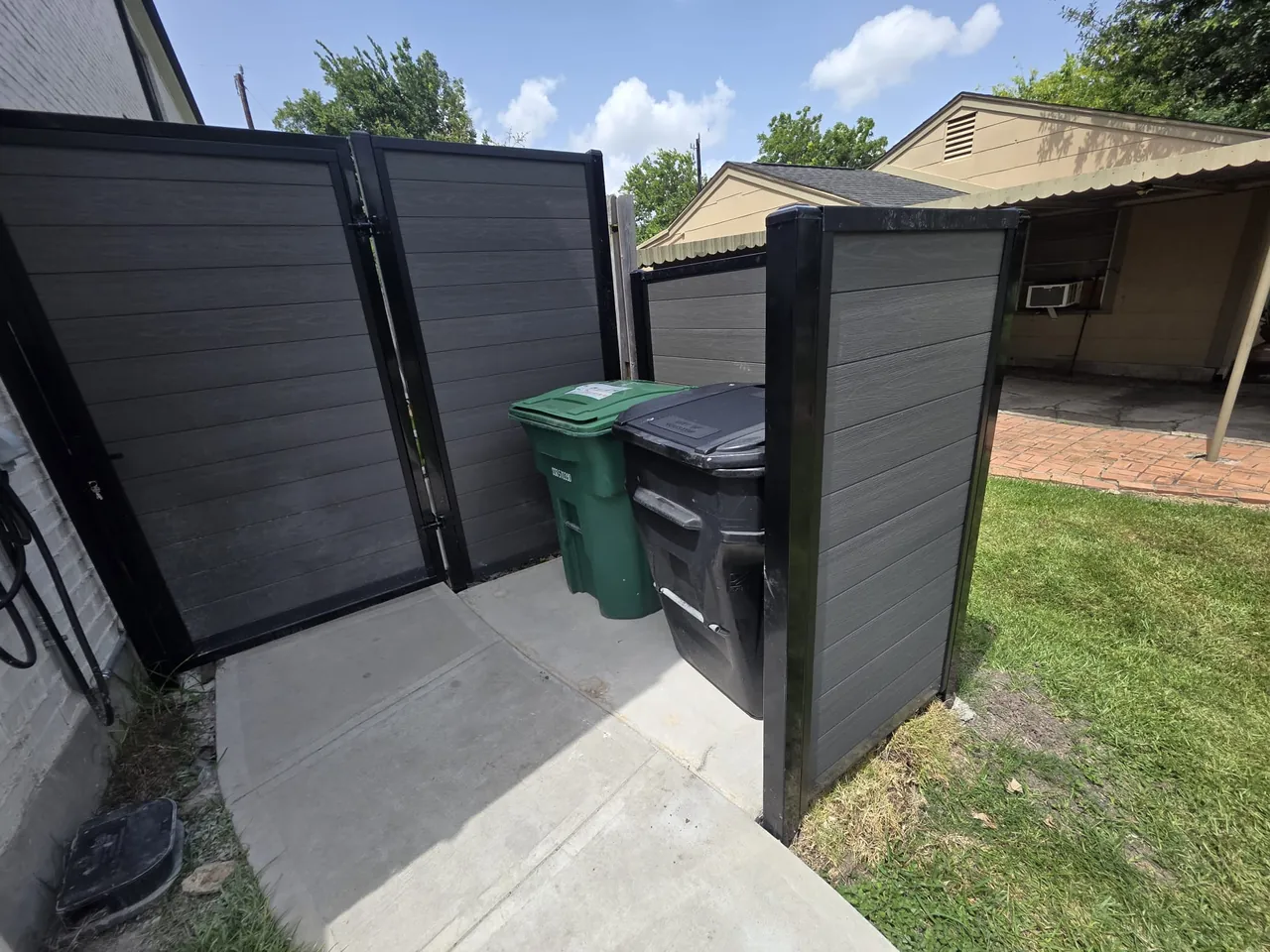 Gate and access section integrated into a completed Composite Picket fence installation.