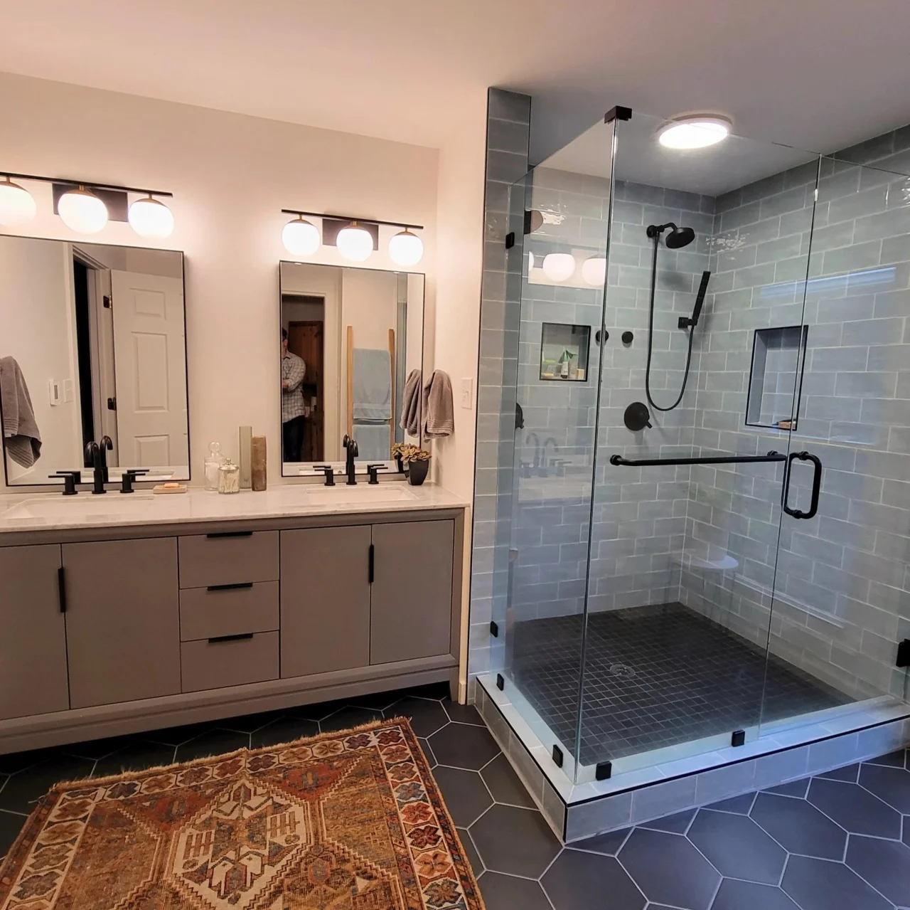 Bathroom example with double vanity and glass shower enclosure.